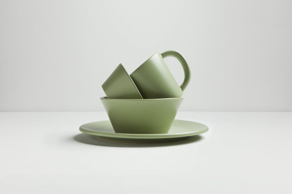 A green serving set stacked artistically by food photographer Nick Reid.